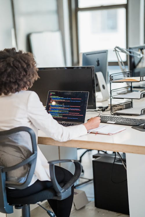 a woman at her work desk